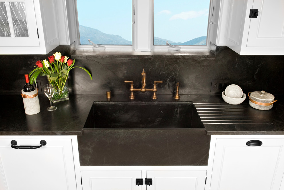 Elegant kitchen photo in San Diego with an integrated sink and soapstone countertops