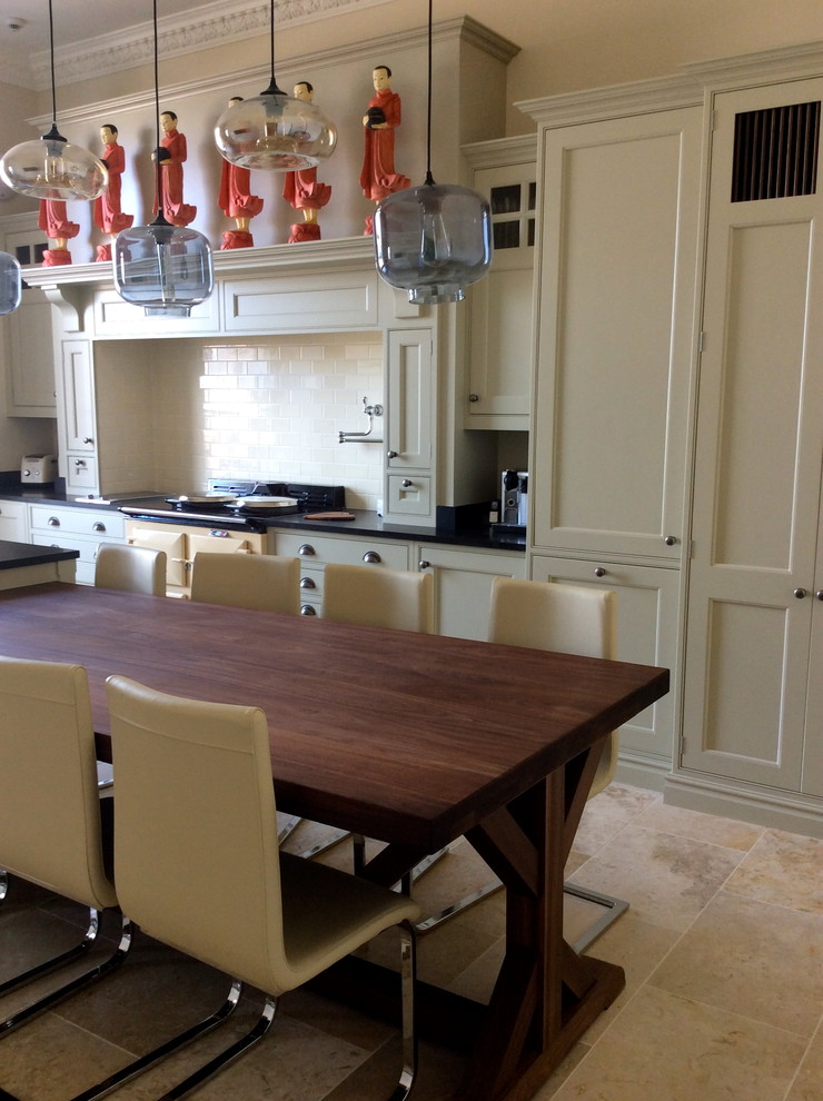 Classic kitchen in Edinburgh with wood worktops, beige splashback, metro tiled splashback and coloured appliances.