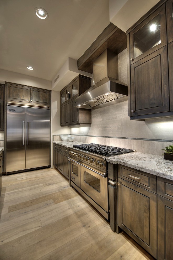 Large transitional l-shaped light wood floor open concept kitchen photo in Phoenix with a double-bowl sink, gray cabinets and stainless steel appliances