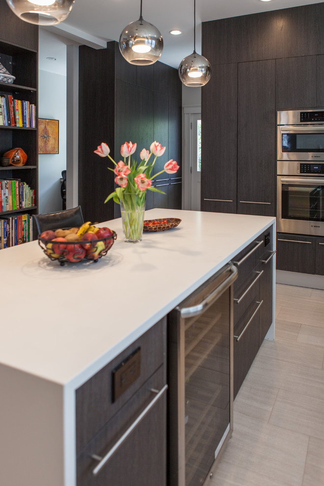 Mid-sized trendy l-shaped light wood floor and beige floor eat-in kitchen photo in Boston with an undermount sink, flat-panel cabinets, dark wood cabinets, quartz countertops, multicolored backsplash, matchstick tile backsplash, stainless steel appliances, an island and white countertops