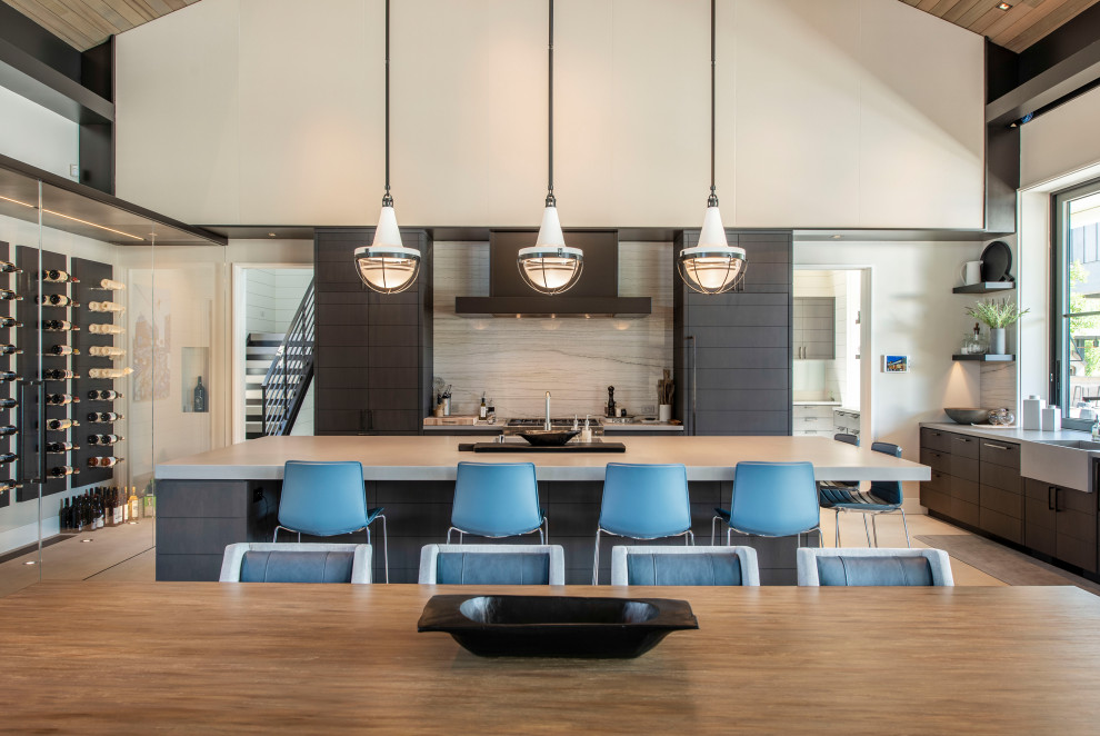 Inspiration for a large modern u-shaped concrete floor and gray floor open concept kitchen remodel in San Francisco with black cabinets, concrete countertops, gray backsplash, marble backsplash, paneled appliances, an island and multicolored countertops