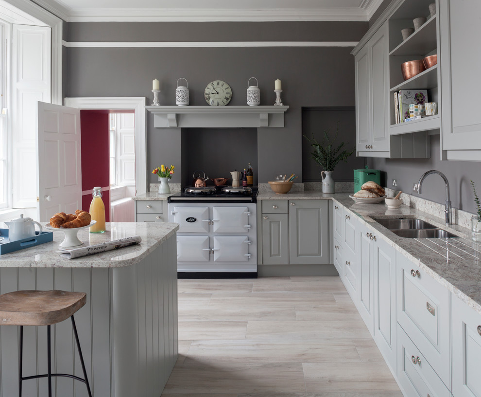 This is an example of a medium sized classic l-shaped enclosed kitchen in Other with an integrated sink, raised-panel cabinets, grey cabinets, granite worktops, integrated appliances, porcelain flooring, an island, beige floors and grey worktops.