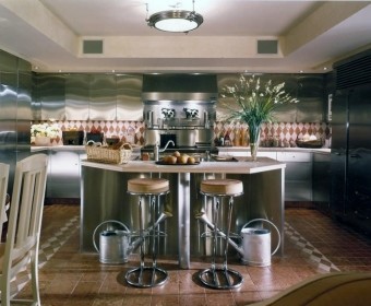 This is an example of an expansive modern u-shaped kitchen/diner in New York with a single-bowl sink, flat-panel cabinets, stainless steel cabinets, limestone worktops, multi-coloured splashback, marble splashback, stainless steel appliances, marble flooring, an island and multi-coloured floors.