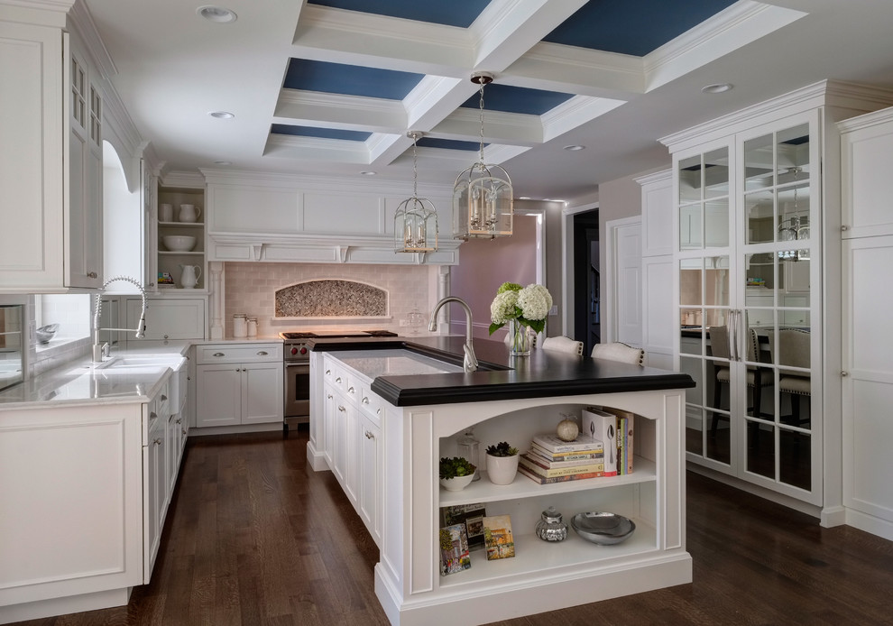 Inspiration for a timeless dark wood floor kitchen remodel in Chicago with a farmhouse sink, shaker cabinets, white cabinets, wood countertops, ceramic backsplash, stainless steel appliances and an island