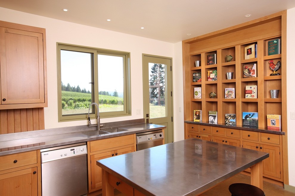 Inspiration for a country kitchen remodel in Portland with an integrated sink, zinc countertops, shaker cabinets, medium tone wood cabinets and stainless steel appliances