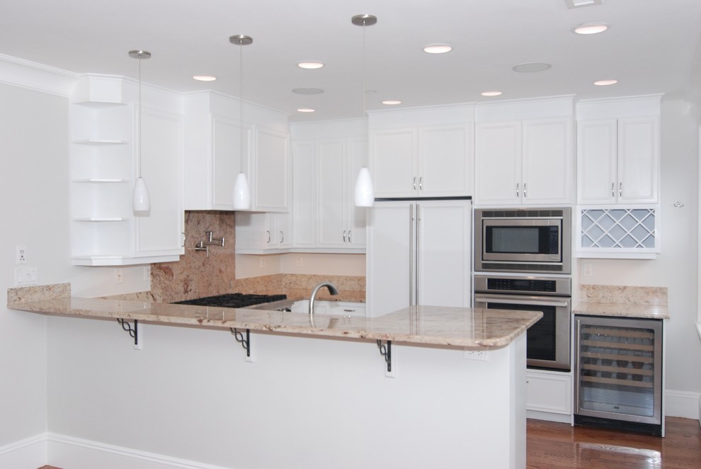 Inspiration for a small timeless u-shaped medium tone wood floor eat-in kitchen remodel in Boston with recessed-panel cabinets, white cabinets, granite countertops, stainless steel appliances and no island