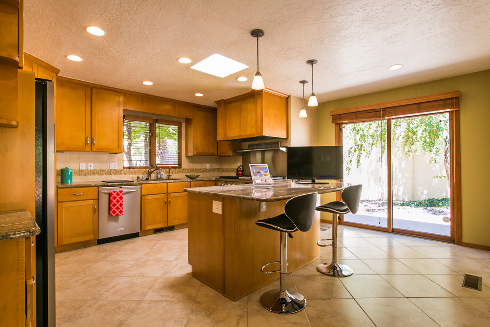 Large trendy u-shaped ceramic tile enclosed kitchen photo in Albuquerque with a double-bowl sink, shaker cabinets, light wood cabinets, granite countertops, multicolored backsplash, mosaic tile backsplash, stainless steel appliances and a peninsula