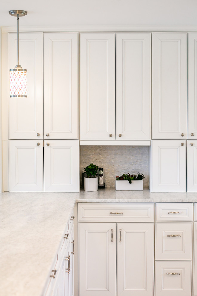 Design ideas for an expansive traditional l-shaped kitchen/diner in Denver with a submerged sink, recessed-panel cabinets, white cabinets, granite worktops, white splashback, marble splashback, stainless steel appliances, porcelain flooring, an island, grey floors and white worktops.