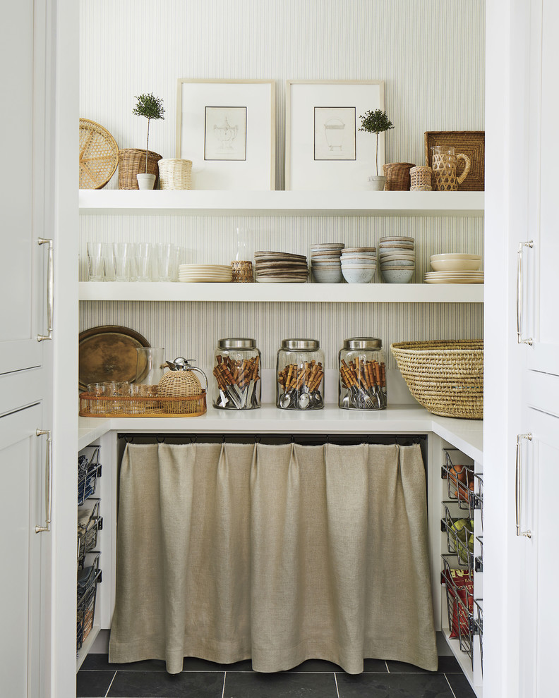 Inspiration for a coastal u-shaped black floor kitchen pantry remodel in Jacksonville with white countertops