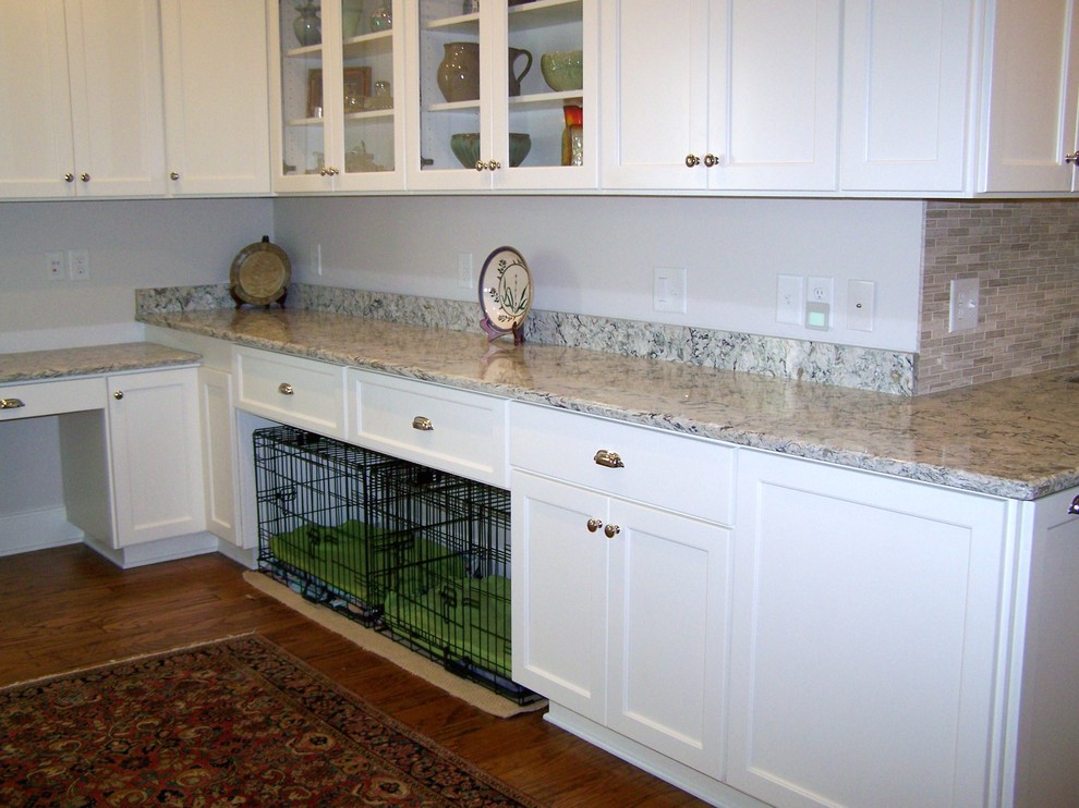 Transitional kitchen photo in Raleigh with white cabinets, quartz countertops, beige backsplash and stone tile backsplash