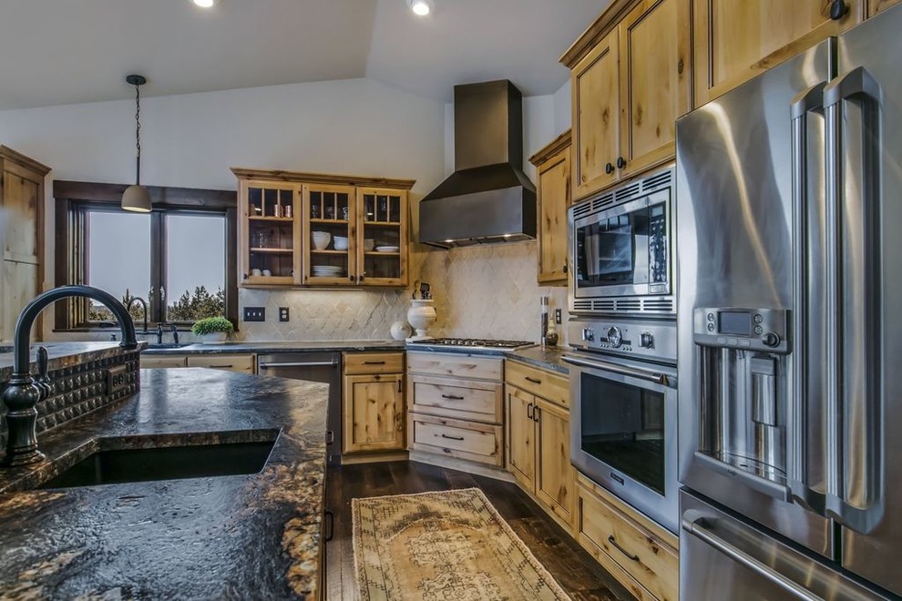 Large l-shaped kitchen/diner in Other with a submerged sink, recessed-panel cabinets, light wood cabinets, granite worktops, beige splashback, stainless steel appliances, dark hardwood flooring, an island and brown floors.