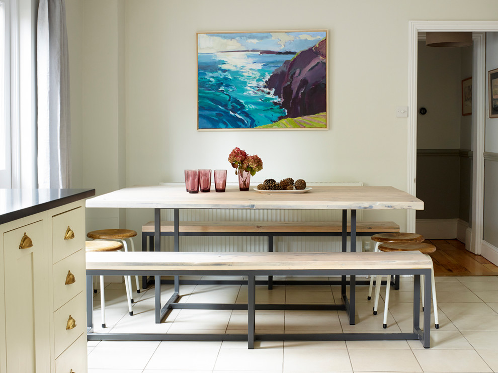 This is an example of a nautical kitchen/dining room in London with ceramic flooring.