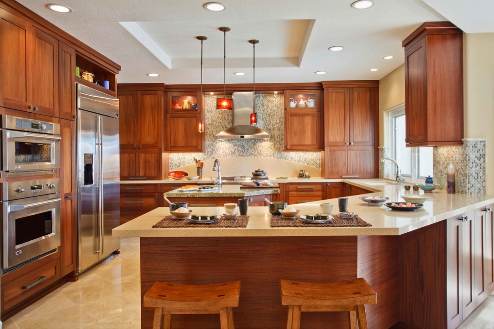 This is an example of a traditional u-shaped kitchen in San Diego with a submerged sink, shaker cabinets, medium wood cabinets, multi-coloured splashback, mosaic tiled splashback, stainless steel appliances and an island.