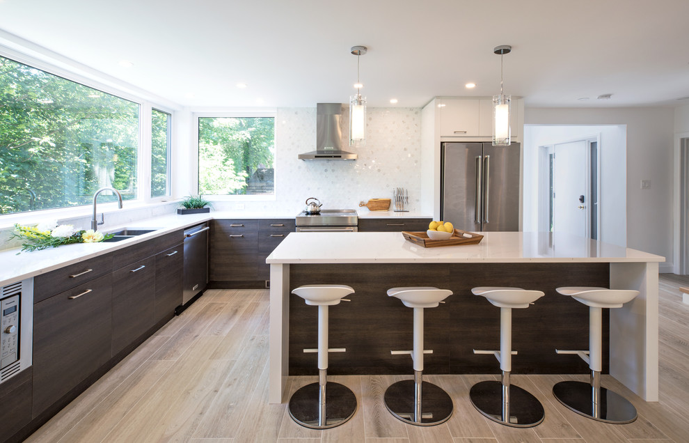 Eat-in kitchen - modern l-shaped light wood floor and beige floor eat-in kitchen idea in Toronto with an undermount sink, flat-panel cabinets, dark wood cabinets, quartz countertops, white backsplash, mosaic tile backsplash, stainless steel appliances, an island and white countertops