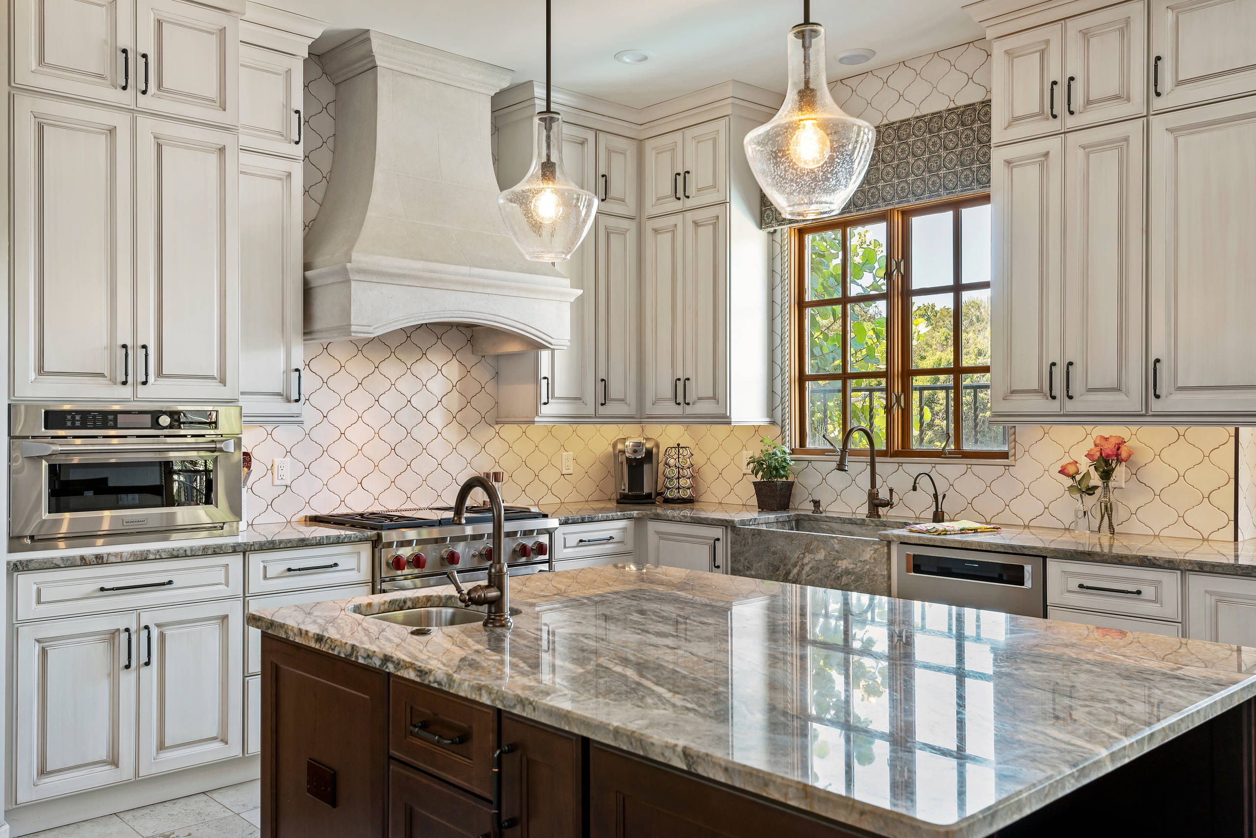 Beige granite countertops with white cabinets