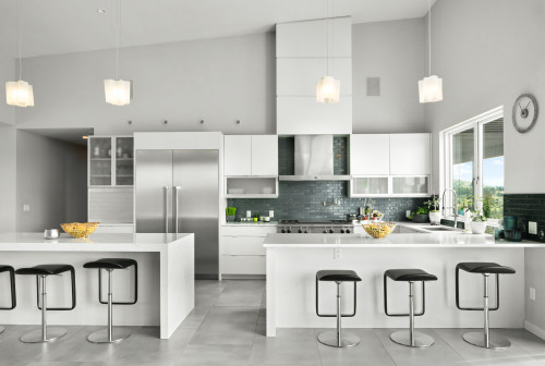 Glossy Elegance: White Cabinets with a Gray Glossy Backsplash and Gray Floor Tiles