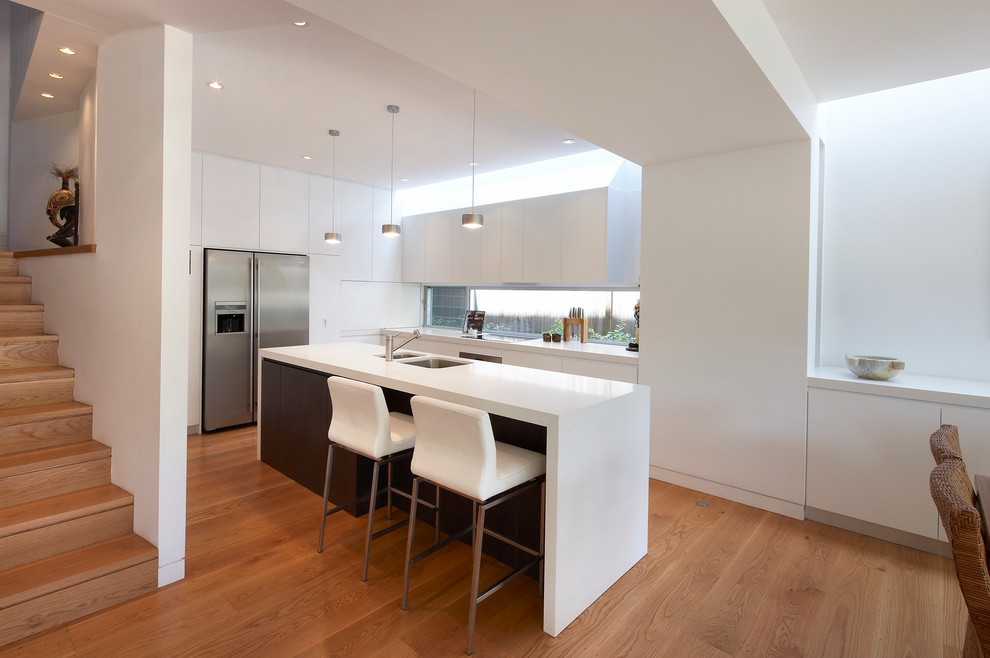 This is an example of a contemporary kitchen in Sydney with stainless steel appliances.