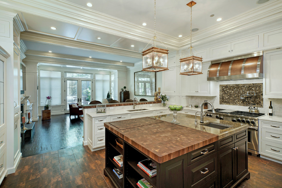 Inspiration for a huge timeless u-shaped dark wood floor eat-in kitchen remodel in Chicago with an undermount sink, stainless steel appliances, an island, shaker cabinets, white cabinets, marble countertops, white backsplash and stone slab backsplash