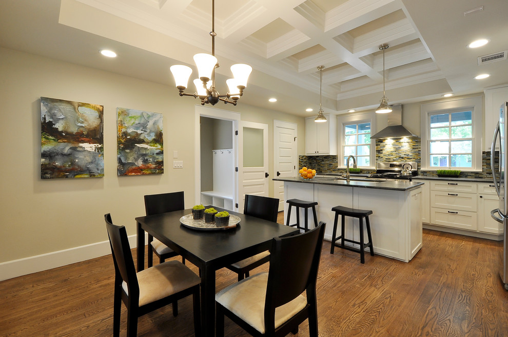 Photo of a traditional kitchen in Austin with soapstone worktops, a submerged sink, shaker cabinets, white cabinets, multi-coloured splashback, matchstick tiled splashback, stainless steel appliances and black worktops.