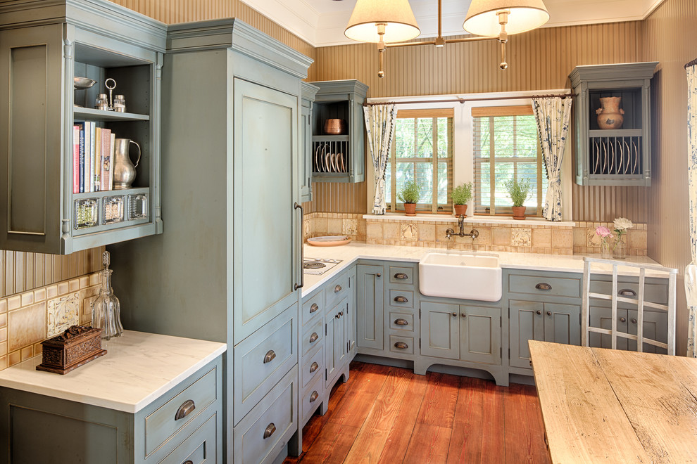 Photo of a traditional kitchen in Atlanta with a belfast sink, shaker cabinets, blue cabinets, beige splashback, medium hardwood flooring and no island.