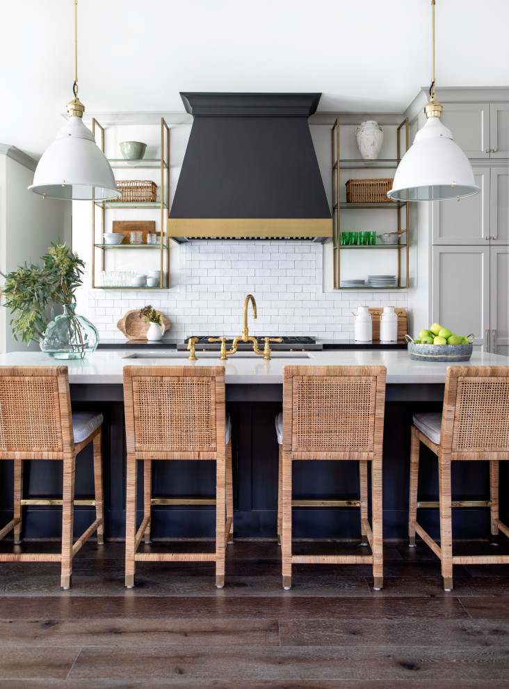 Inspiration for a large eclectic single-wall open concept kitchen remodel in Houston with shaker cabinets, gray cabinets, stainless steel appliances and an island