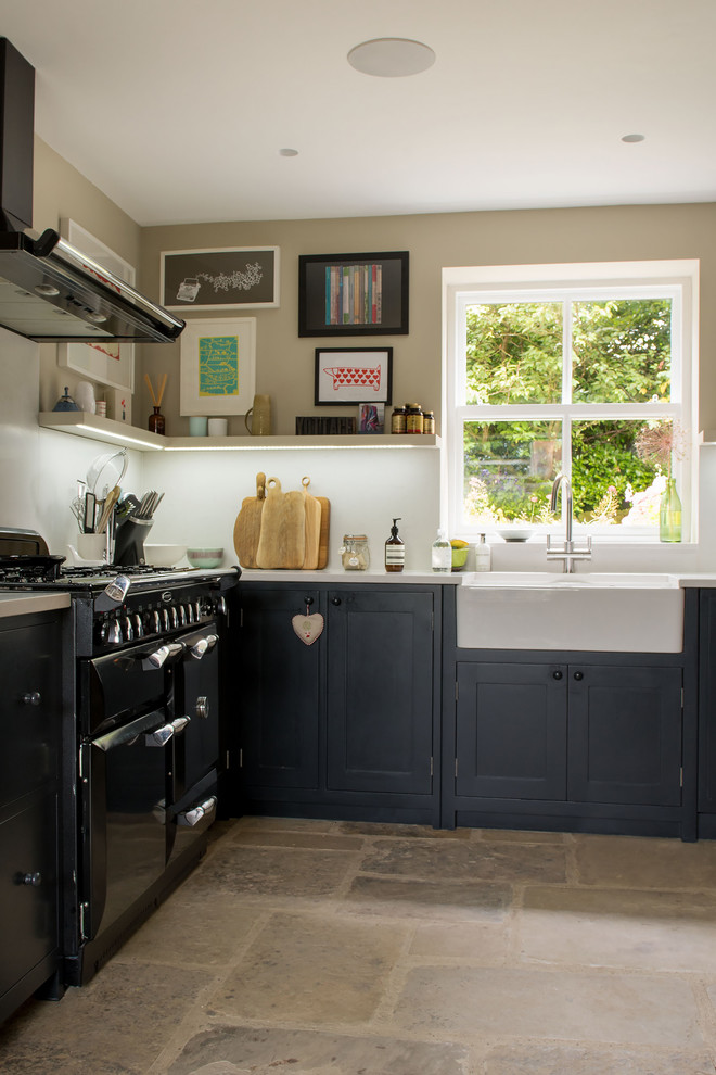 This is an example of a large eclectic l-shaped open plan kitchen in Other with a belfast sink, shaker cabinets, blue cabinets, white splashback and no island.