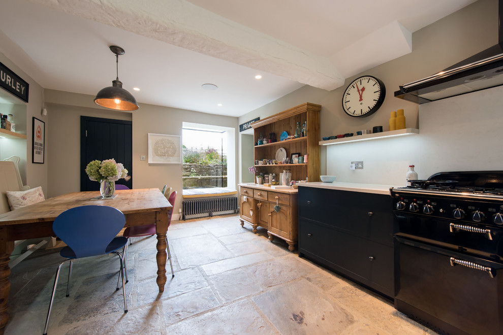 Photo of a large eclectic l-shaped open plan kitchen in Other with a belfast sink, shaker cabinets, blue cabinets, white splashback and no island.