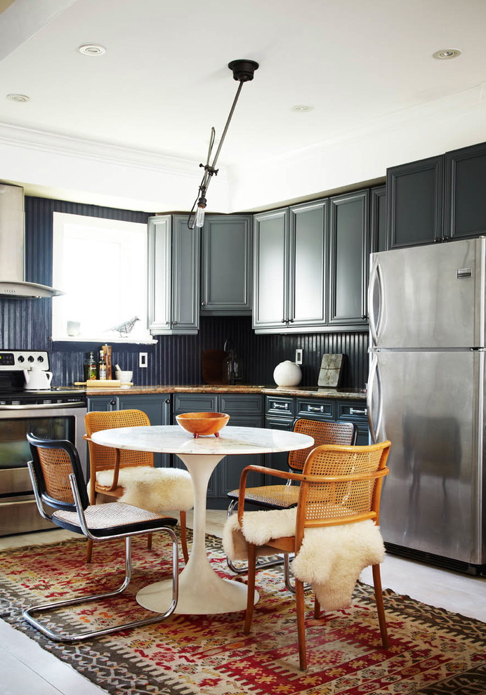 Photo of a bohemian kitchen in Toronto with stainless steel appliances.