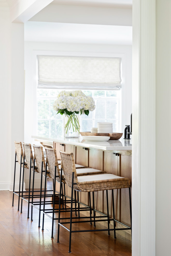 Inspiration for a large transitional galley medium tone wood floor and brown floor open concept kitchen remodel in Orlando with a farmhouse sink, shaker cabinets and an island