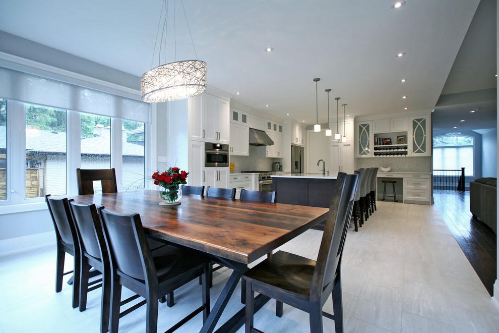 Large traditional open plan dining room in Toronto with porcelain flooring and beige floors.