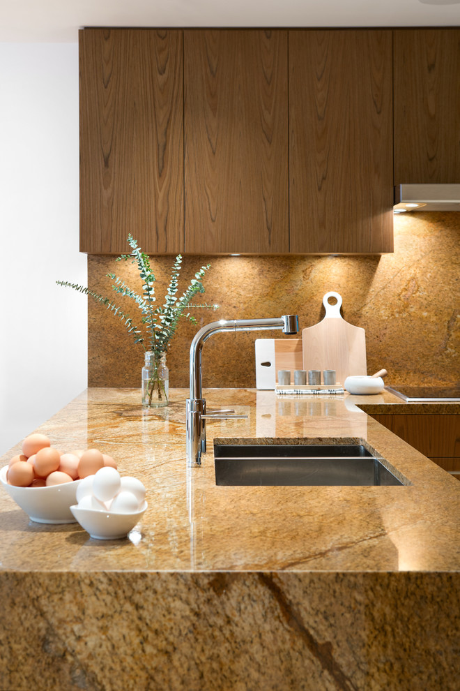 Medium sized contemporary u-shaped kitchen/diner in Vancouver with a submerged sink, flat-panel cabinets, medium wood cabinets, granite worktops, multi-coloured splashback, stone slab splashback, integrated appliances, porcelain flooring and a breakfast bar.