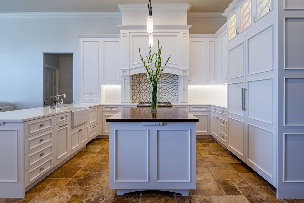 Medium sized classic u-shaped open plan kitchen in Tampa with a belfast sink, shaker cabinets, white cabinets, wood worktops, glass tiled splashback, integrated appliances, marble flooring, an island and multi-coloured floors.