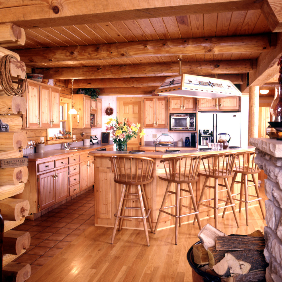 Mountain style medium tone wood floor open concept kitchen photo in Boston with a drop-in sink, shaker cabinets and medium tone wood cabinets