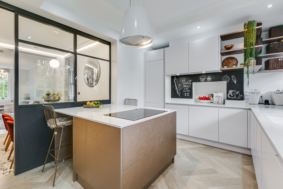 Photo of a medium sized contemporary l-shaped kitchen in London with flat-panel cabinets, grey cabinets, engineered stone countertops and an island.