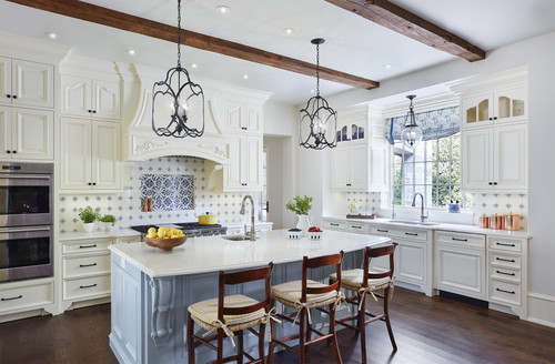 light blue island in traditional french kitchen