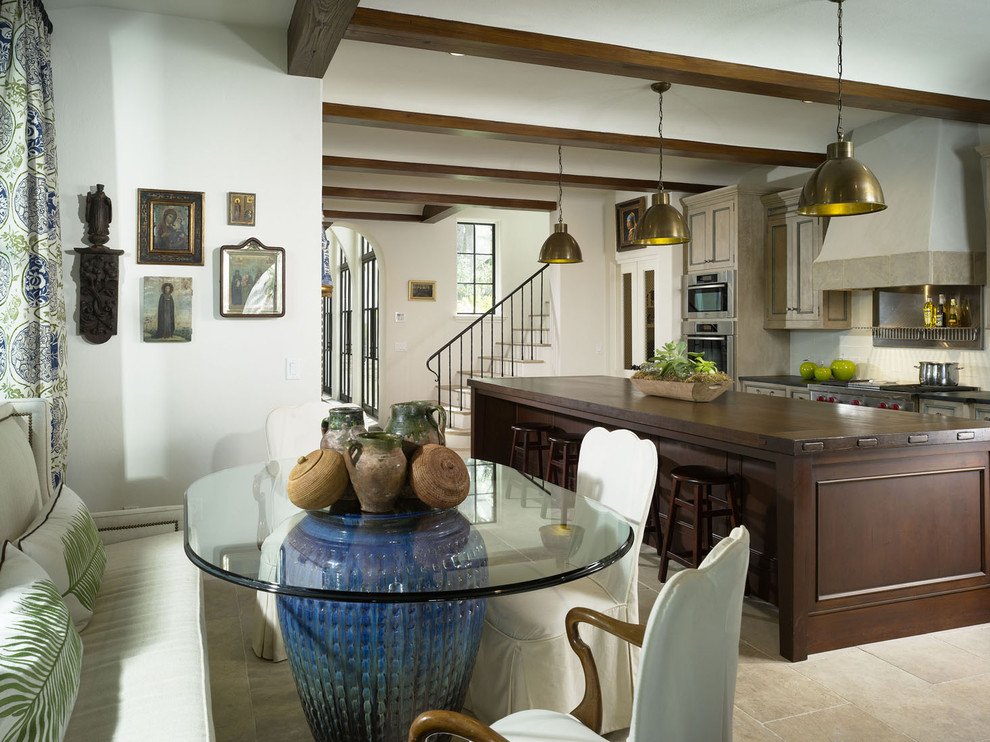 Example of a tuscan single-wall eat-in kitchen design in Atlanta with wood countertops