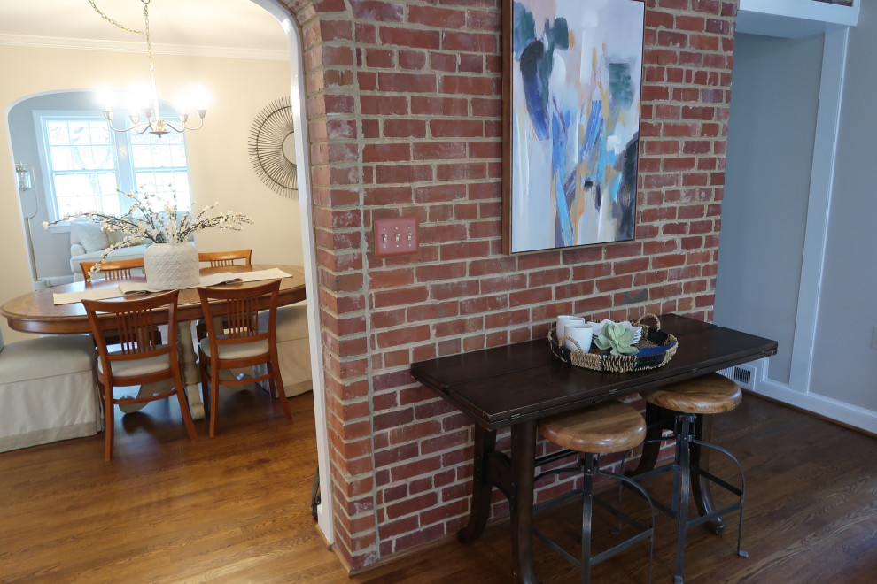 Example of a small urban dark wood floor kitchen/dining room combo design in DC Metro