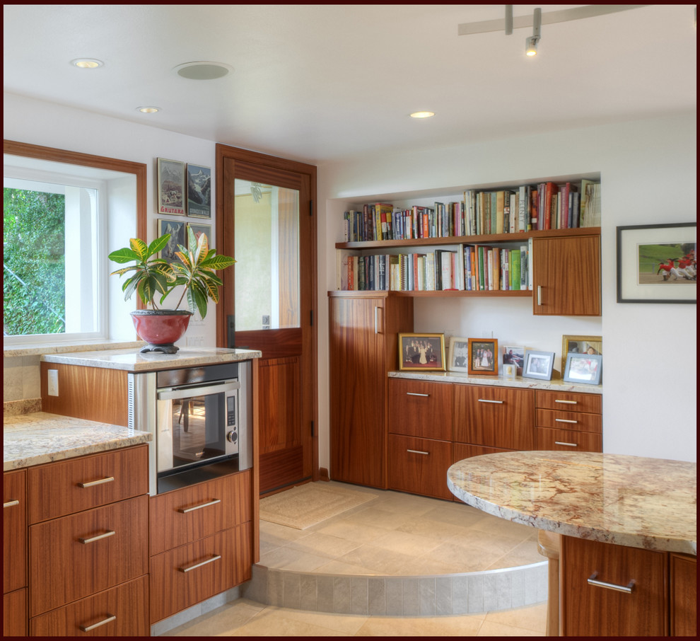 Inspiration for a mid-sized transitional l-shaped porcelain tile enclosed kitchen remodel in Seattle with an undermount sink, flat-panel cabinets, medium tone wood cabinets, granite countertops, stainless steel appliances and no island