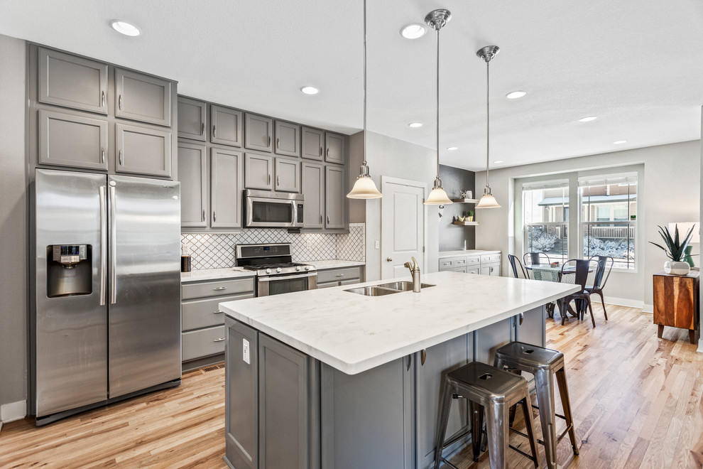 This is an example of a medium sized modern kitchen in Denver.