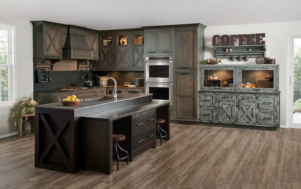 Photo of a country kitchen/diner in Other with a submerged sink, beaded cabinets, dark wood cabinets, stainless steel appliances, medium hardwood flooring, an island and brown floors.