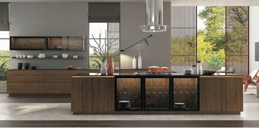 Стильный дизайн: большая параллельная кухня в стиле модернизм с плоскими фасадами, техникой из нержавеющей стали, островом, обеденным столом, монолитной мойкой, черными фасадами и стеклянной столешницей - последний тренд