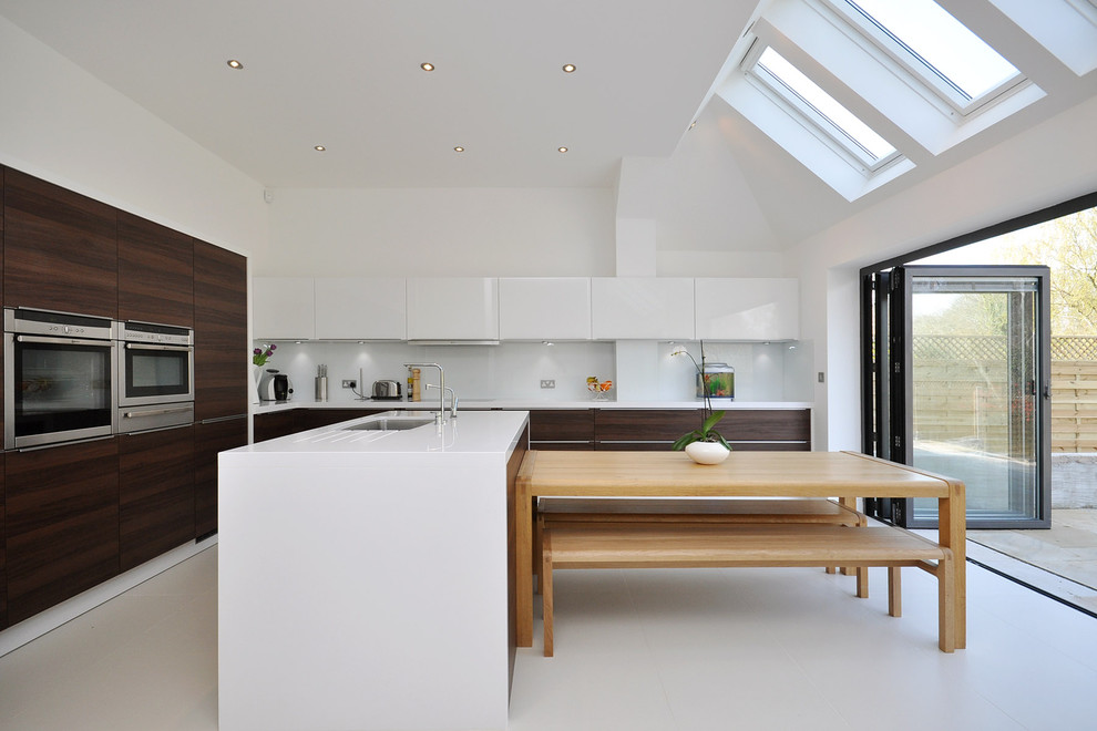 Design ideas for a contemporary kitchen in London with stainless steel appliances.