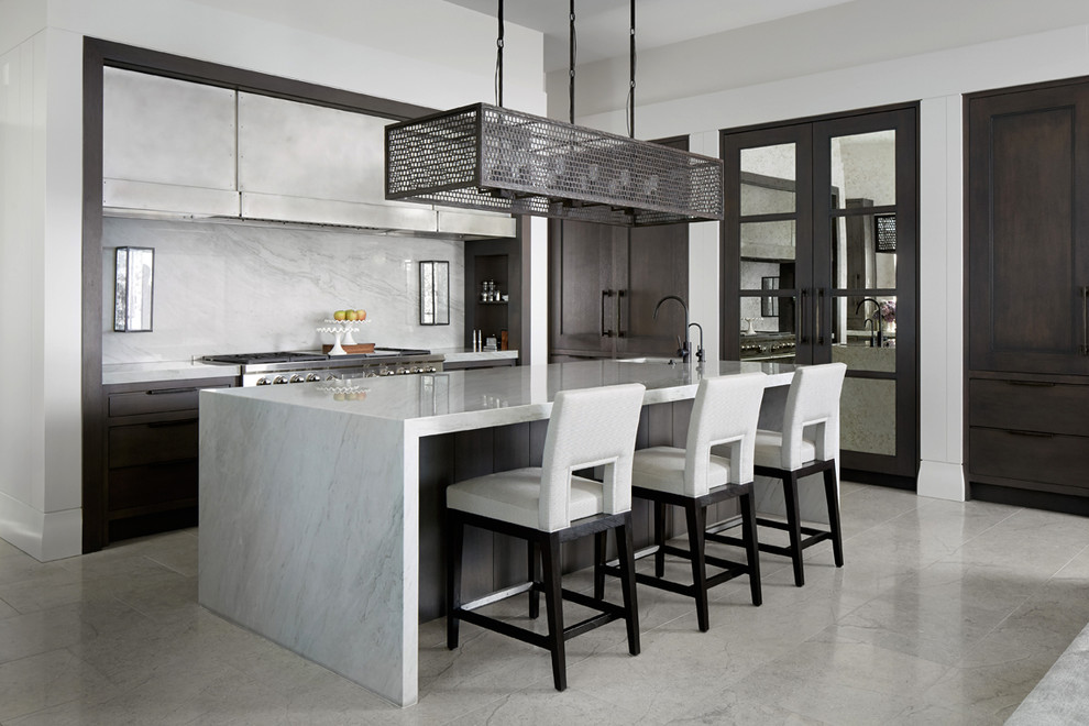Inspiration for a contemporary l-shaped kitchen in Chicago with recessed-panel cabinets, dark wood cabinets, white splashback, stone slab splashback, stainless steel appliances, an island, grey floors and white worktops.