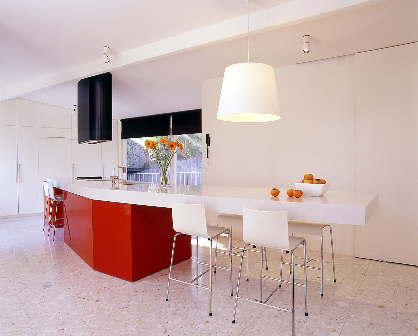 Stone Italiana White bench top and red Kitchen Modern