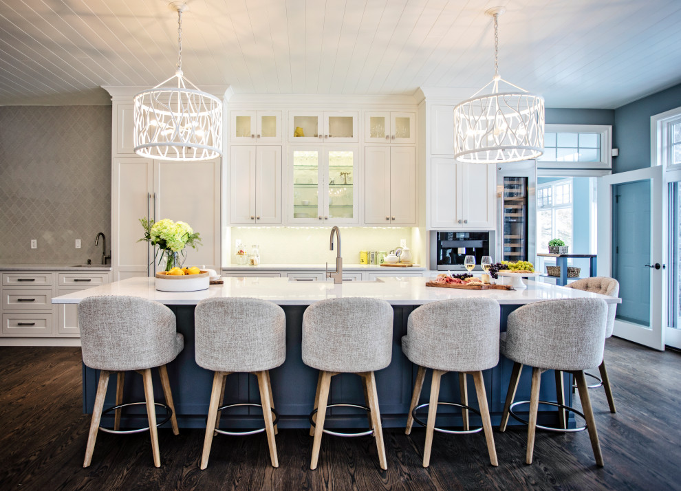 Inspiration for a large coastal galley dark wood floor, brown floor and shiplap ceiling open concept kitchen remodel in Toronto with white cabinets, quartz countertops, glass tile backsplash, an island, white countertops, a farmhouse sink, shaker cabinets and paneled appliances