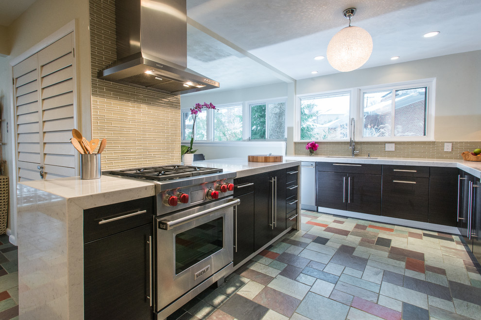 Inspiration for a mid-sized contemporary l-shaped ceramic tile enclosed kitchen remodel in St Louis with an undermount sink, flat-panel cabinets, dark wood cabinets, quartz countertops, yellow backsplash, glass tile backsplash, stainless steel appliances and a peninsula