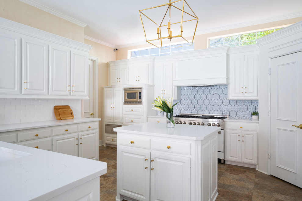 Inspiration for a medium sized traditional kitchen in Dallas with a submerged sink, raised-panel cabinets, white cabinets, engineered stone countertops, blue splashback, ceramic splashback, white appliances, multiple islands and white worktops.