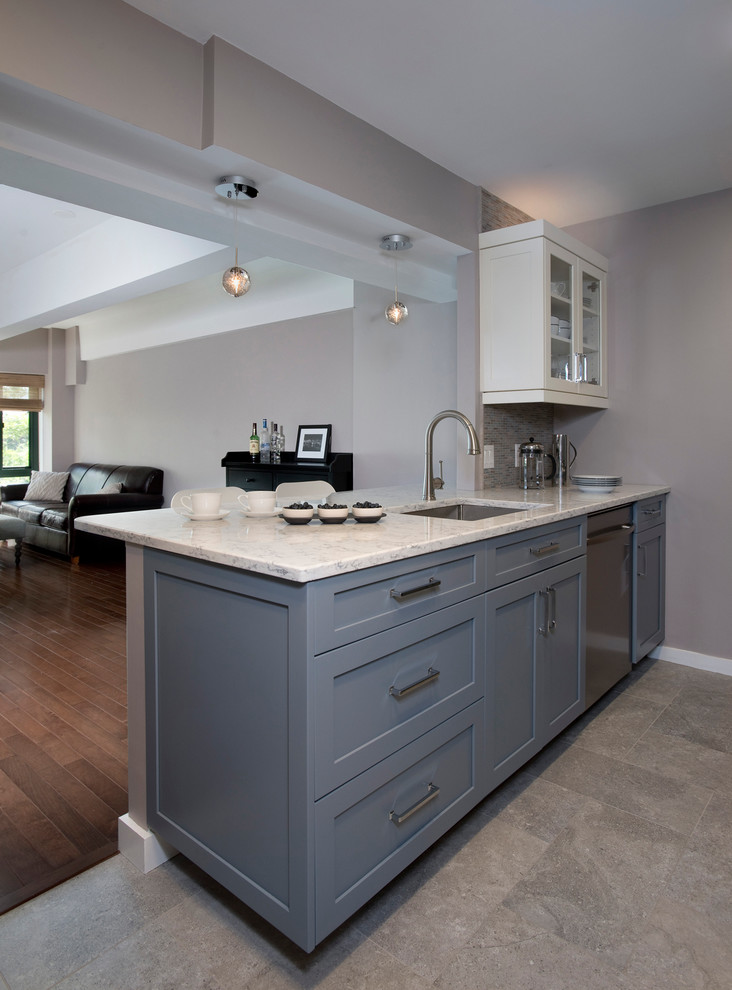 Small transitional galley porcelain tile eat-in kitchen photo in Boston with an undermount sink, shaker cabinets, quartz countertops, multicolored backsplash, mosaic tile backsplash, stainless steel appliances, a peninsula and gray cabinets