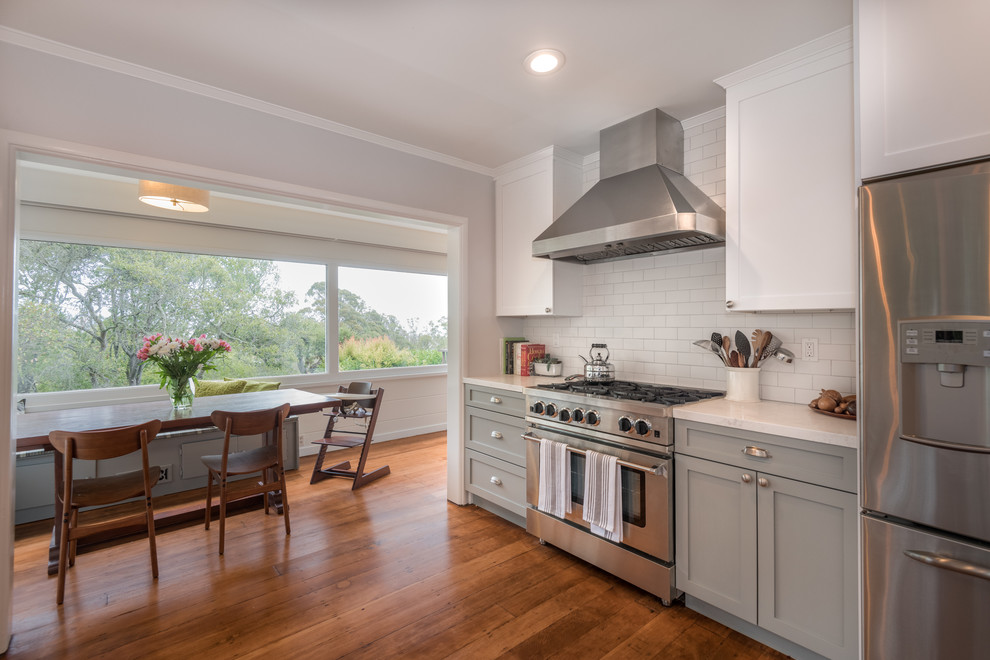 Photo of a medium sized farmhouse kitchen/diner in San Francisco with white cabinets and no island.