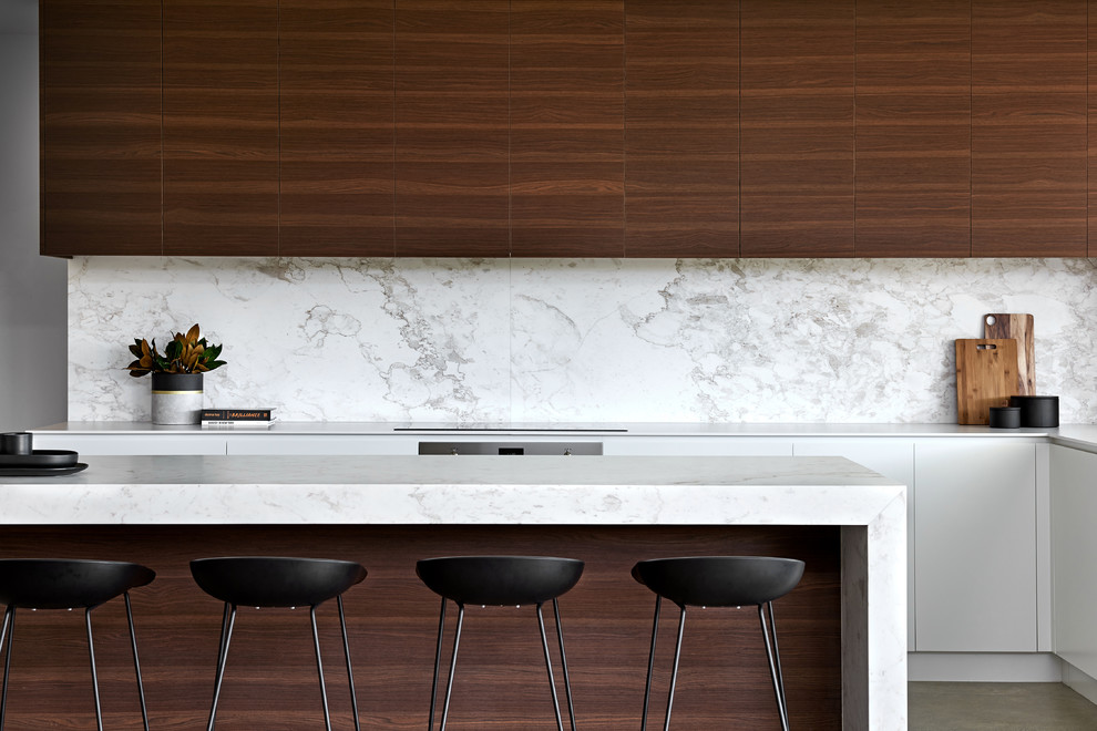 Inspiration for a large contemporary kitchen in Sydney with a double-bowl sink, medium wood cabinets, marble worktops, white splashback, marble splashback, concrete flooring and an island.